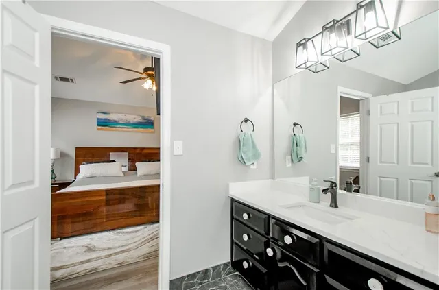 a bathroom with a sink a vanity and a mirror