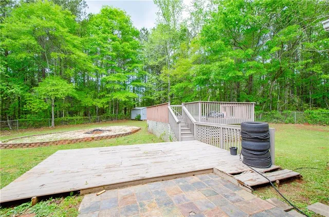 a view of a patio with a table and chairs