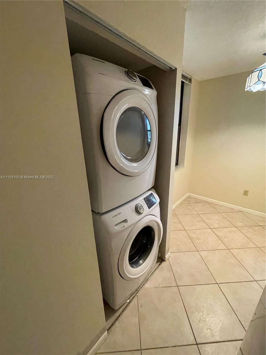 6800 Cypress Road, Unit 208 Plantation, FL 33317 - Photo 13 of 13 a utility room with dryer and washer
