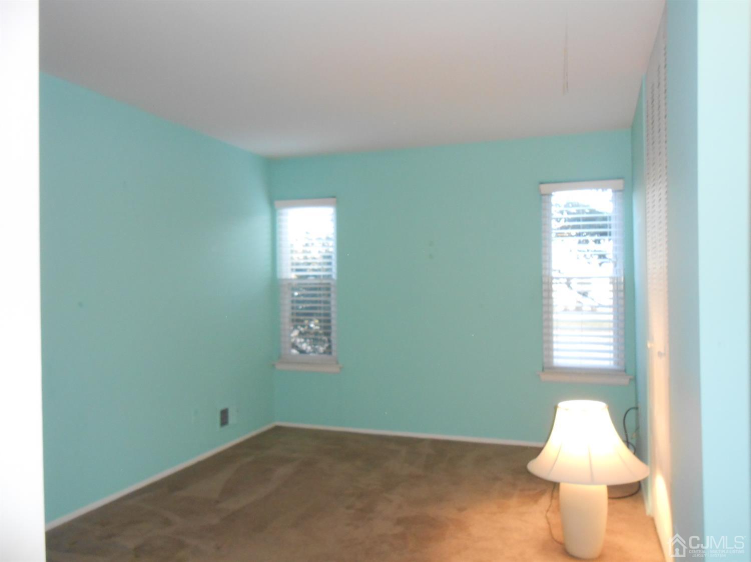 2 Rainford Road Edison, NJ 08820 - Photo 11 of 25 a room with a window and a lamp