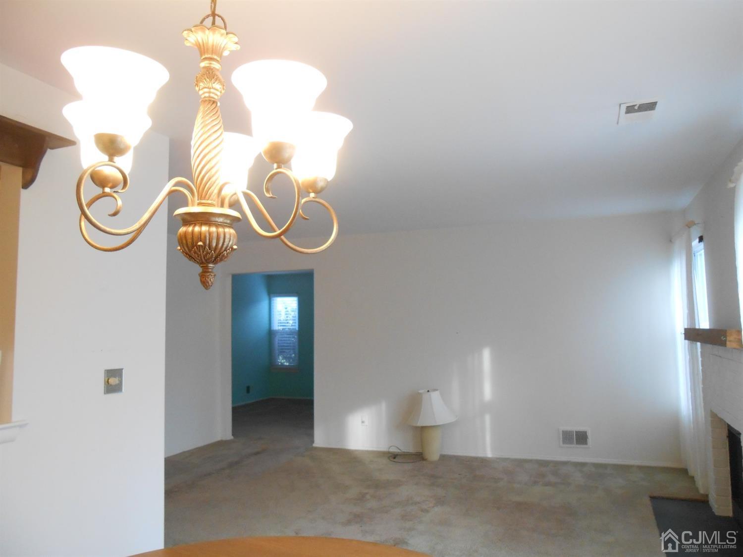 2 Rainford Road Edison, NJ 08820 - Photo 20 of 25 a view of a room with wooden floor and white walls