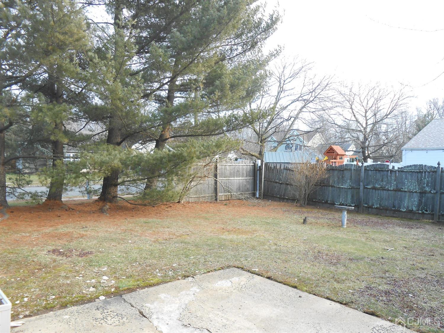 2 Rainford Road Edison, NJ 08820 - Photo 23 of 25 a backyard of a house with wooden fence