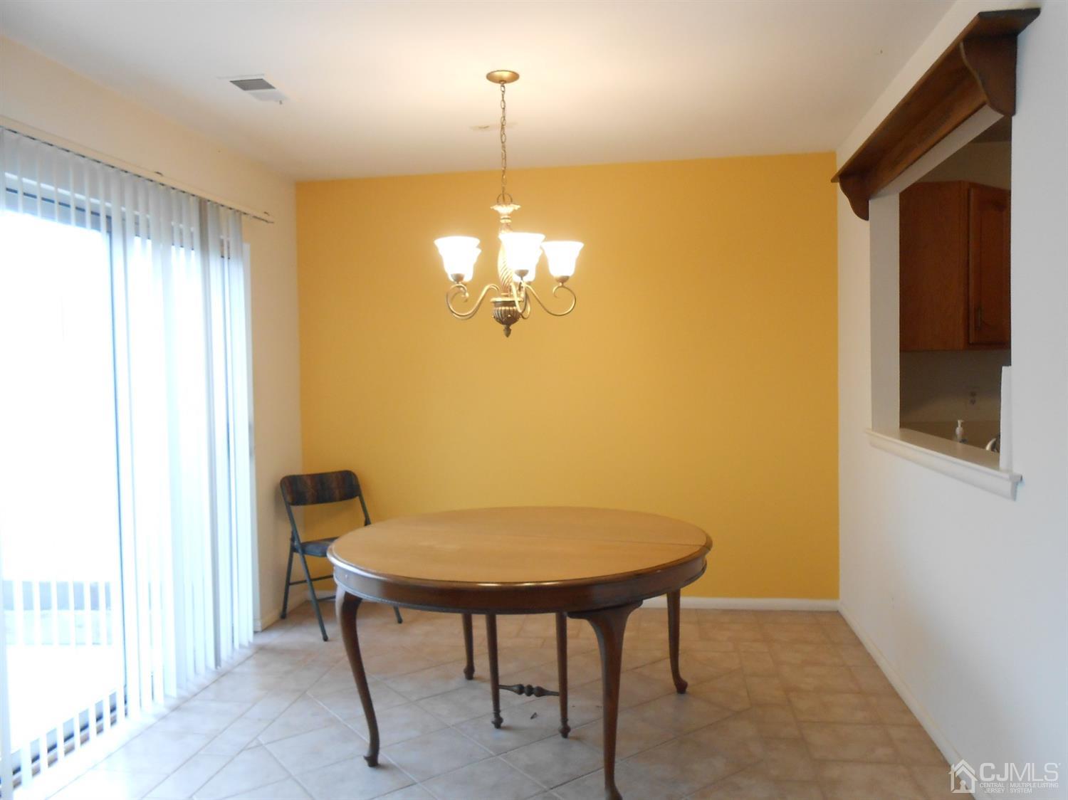 2 Rainford Road Edison, NJ 08820 - Photo 4 of 25 a view of a dining room with a table and chairs