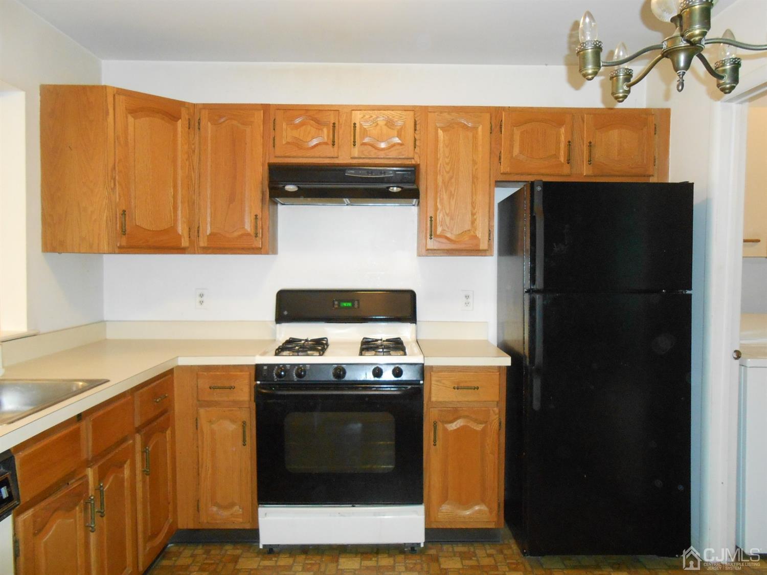 2 Rainford Road Edison, NJ 08820 - Photo 6 of 25 a kitchen with stainless steel appliances granite countertop a refrigerator a stove and a sink