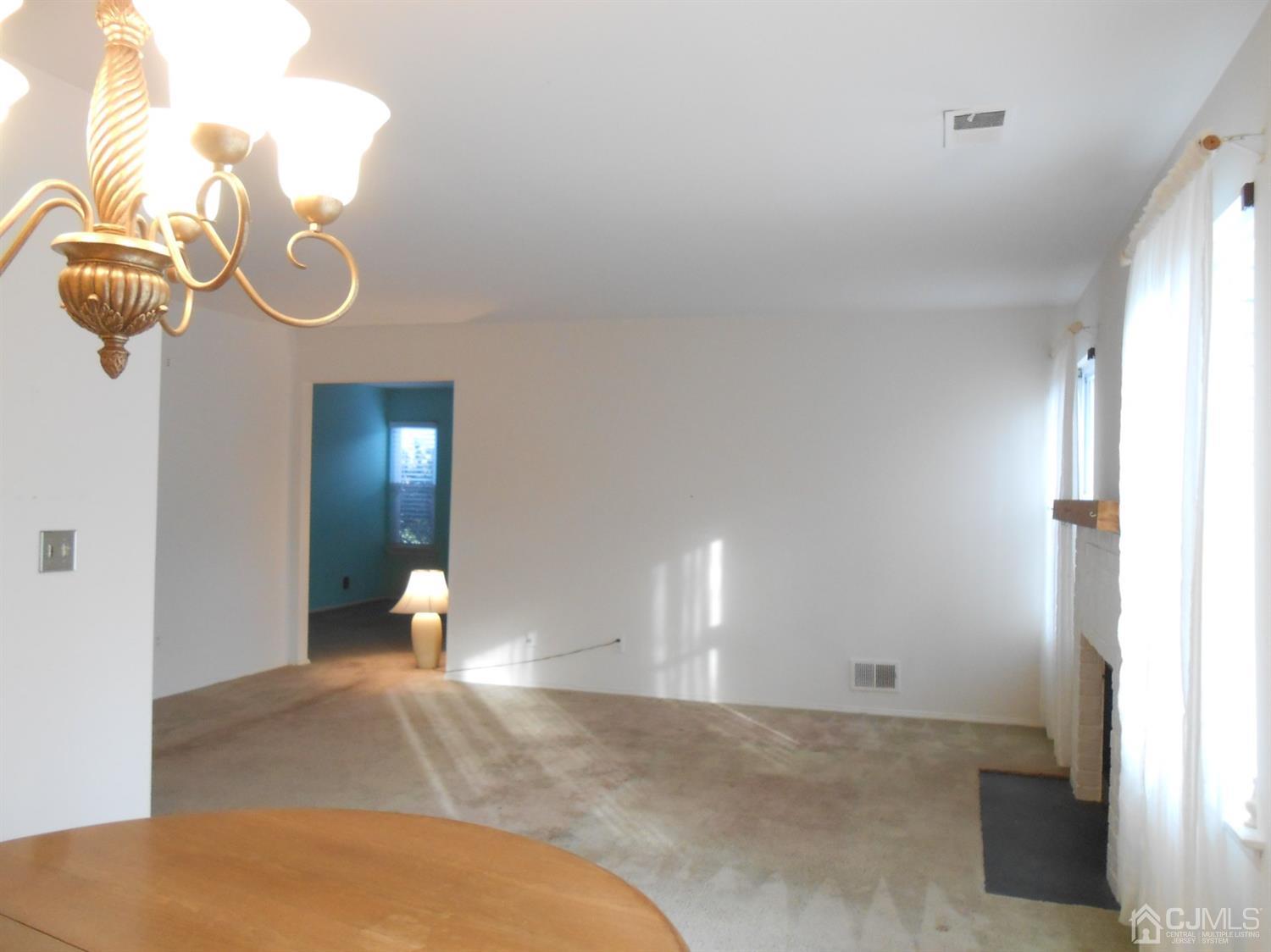 2 Rainford Road Edison, NJ 08820 - Photo 7 of 25 a view of a room with wooden floor and fan