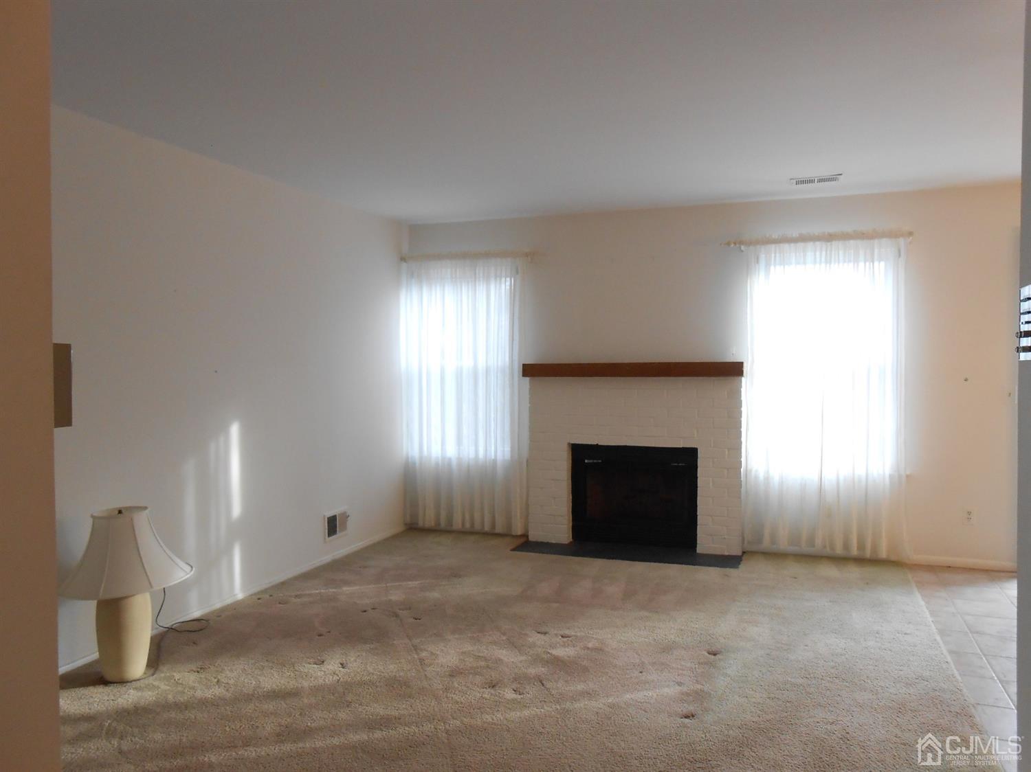 2 Rainford Road Edison, NJ 08820 - Photo 8 of 25 a view of empty room with a fireplace