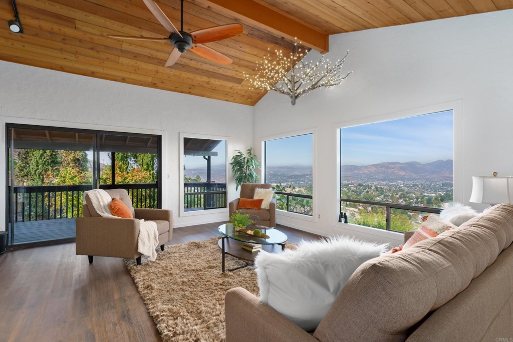 8764 Golden Ridge Road Lakeside, CA 92040 - Photo 8 of 62 a living room with furniture large windows and wooden floor