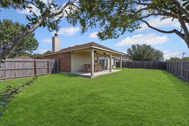 a view of backyard with green space