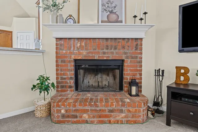 a room with fireplace and wooden floor