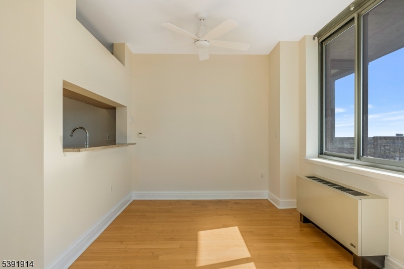 1 Spring Street, Unit 1704 New Brunswick, NJ 08901 - Photo 14 of 44 a view of an empty room with a window