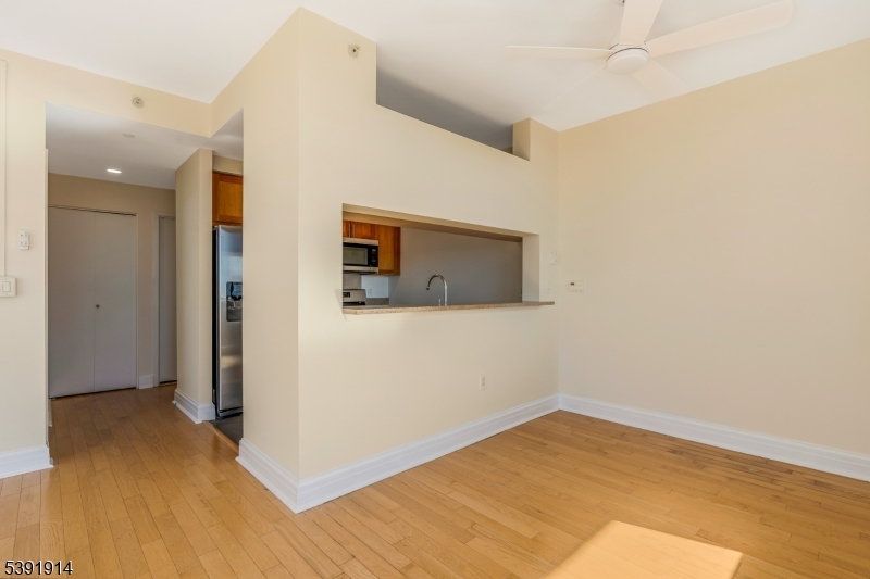 1 Spring Street, Unit 1704 New Brunswick, NJ 08901 - Photo 15 of 44 a view of empty room with wooden floor