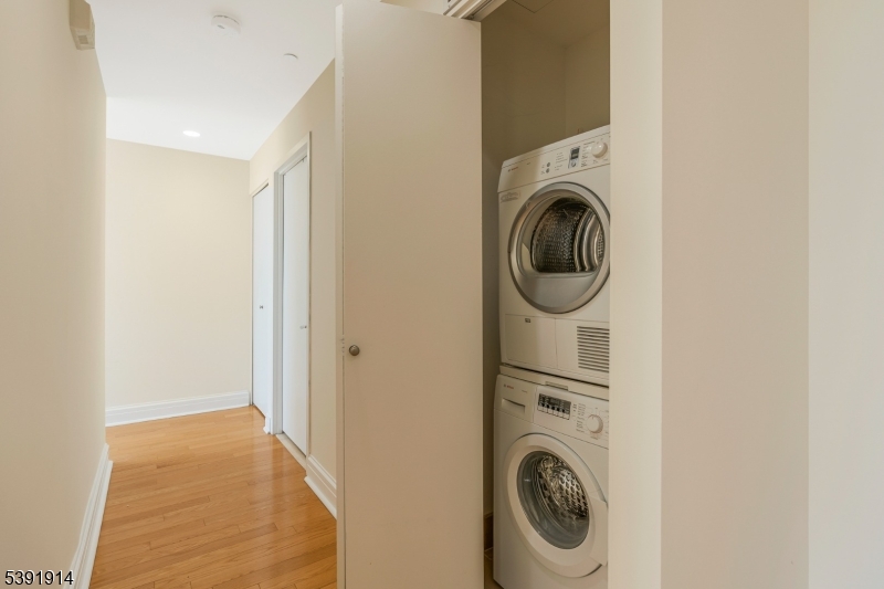 1 Spring Street, Unit 1704 New Brunswick, NJ 08901 - Photo 16 of 44 a utility room with dryer and washer