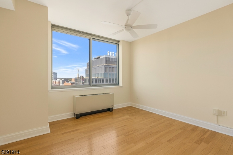 1 Spring Street, Unit 1704 New Brunswick, NJ 08901 - Photo 18 of 44 a view of an empty room with a window