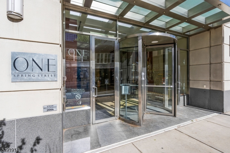 1 Spring Street, Unit 1704 New Brunswick, NJ 08901 - Photo 2 of 44 a view of a hallway with wooden floor