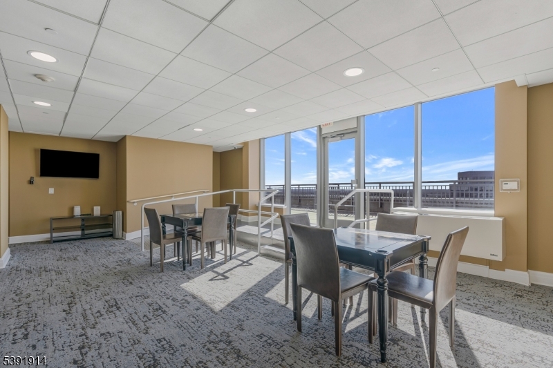 1 Spring Street, Unit 1704 New Brunswick, NJ 08901 - Photo 33 of 44 a view of a dining room with furniture window and outside view