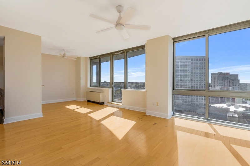 1 Spring Street, Unit 1704 New Brunswick, NJ 08901 - Photo 9 of 44 a view of an empty room with a window