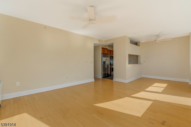 1 Spring Street, Unit 1704 New Brunswick, NJ 08901 - Photo 10 of 44 a view of an empty room with window