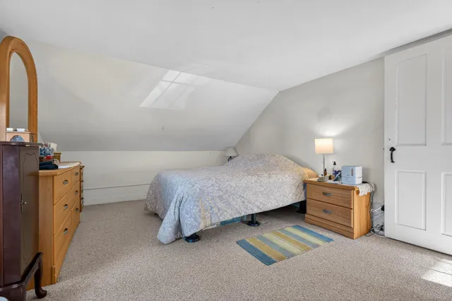 a bedroom with a bed and a cabinets