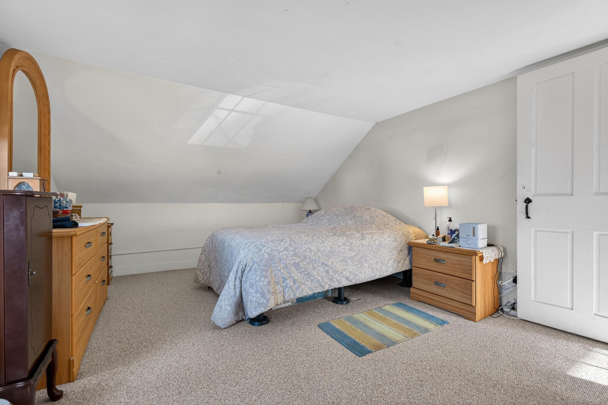 18 Broad Street Killingly, CT 06239 - Photo 13 of 21 a bedroom with a bed and a cabinets