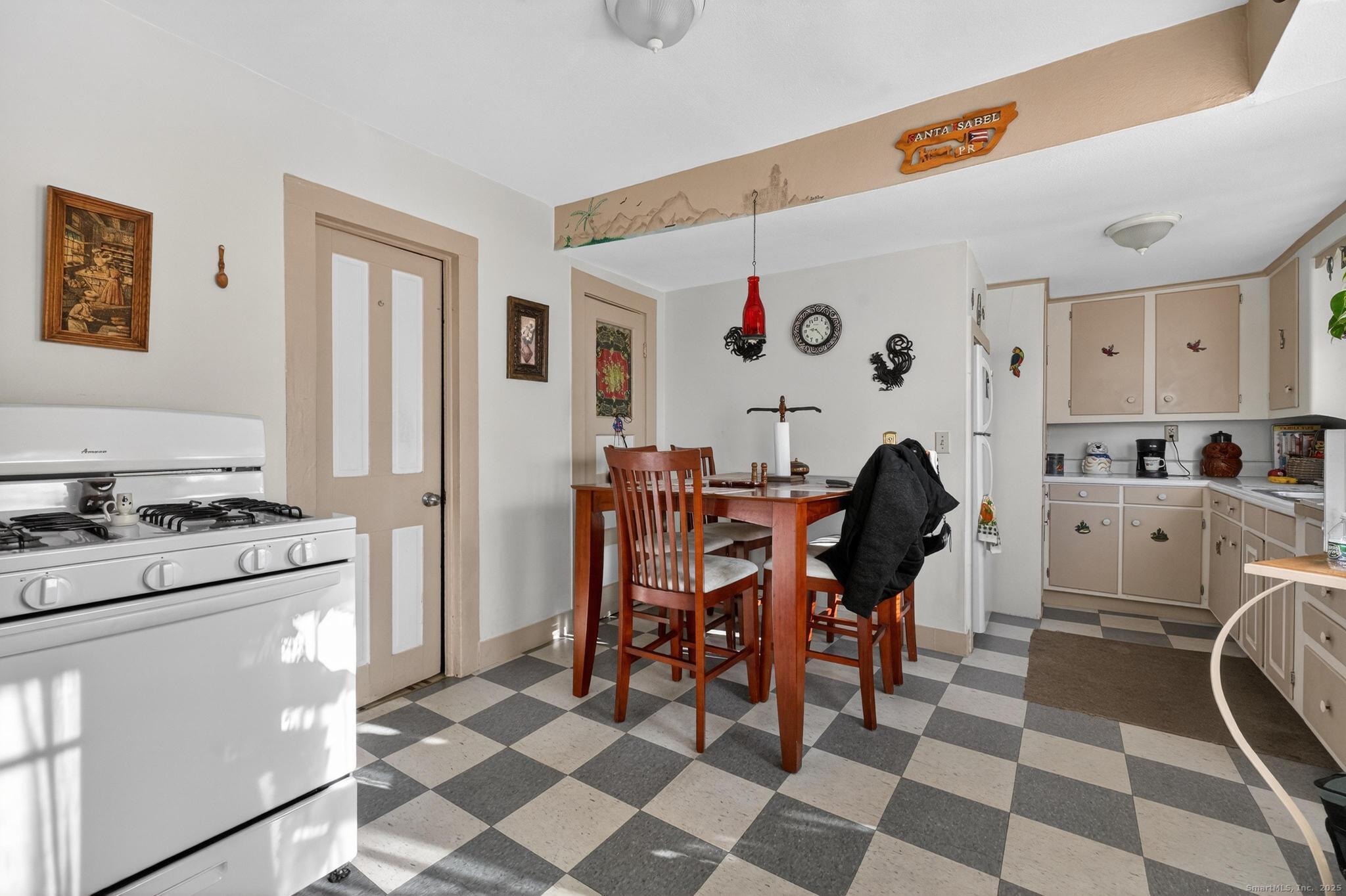 18 Broad Street Killingly, CT 06239 - Photo 18 of 21 a view of a dining room with furniture and a kitchen