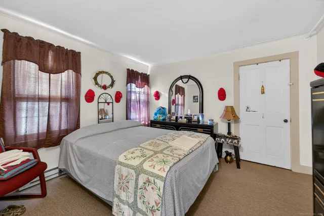 a bed room with a bed and a desk