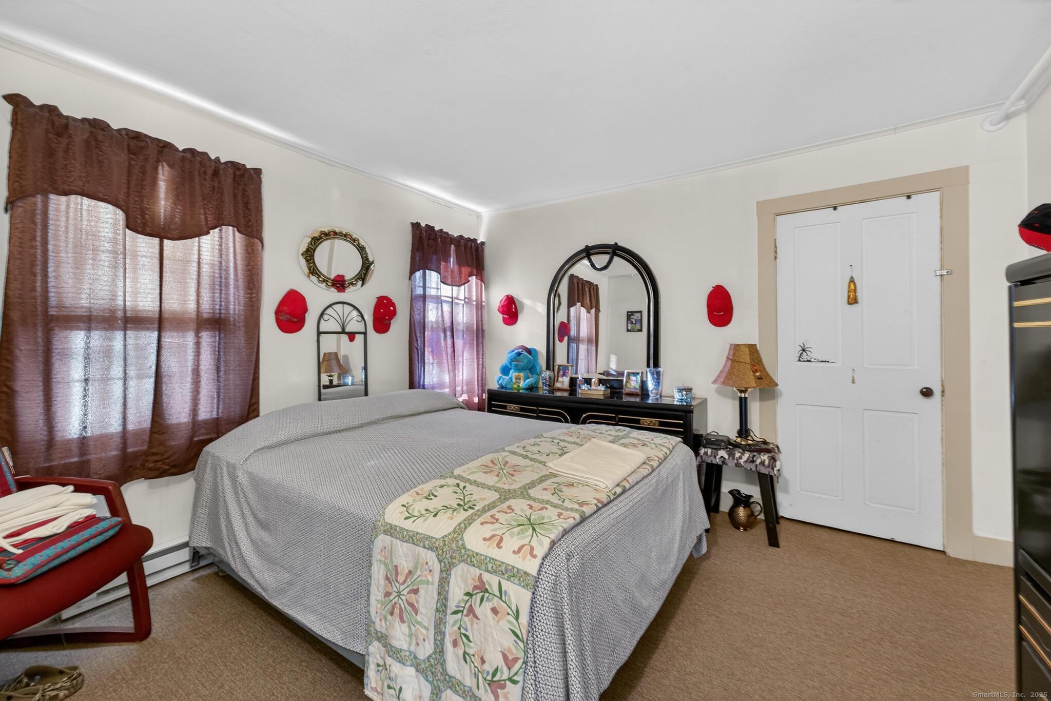 18 Broad Street Killingly, CT 06239 - Photo 20 of 21 a bed room with a bed and a desk