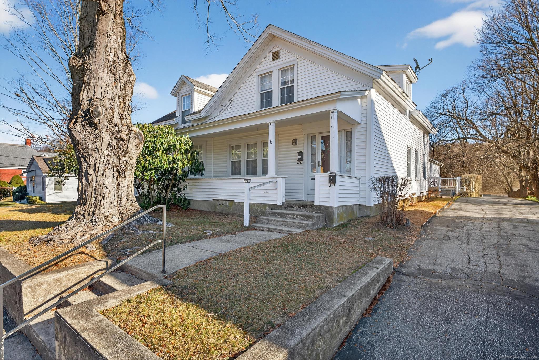 18 Broad Street Killingly, CT 06239 - Photo 2 of 21 a front view of a house with garden