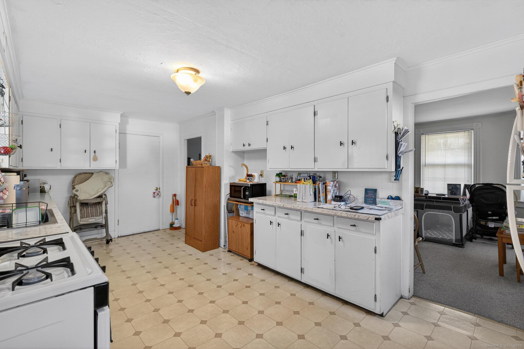 18 Broad Street Killingly, CT 06239 - Photo 7 of 21 a kitchen with a cabinets and appliances