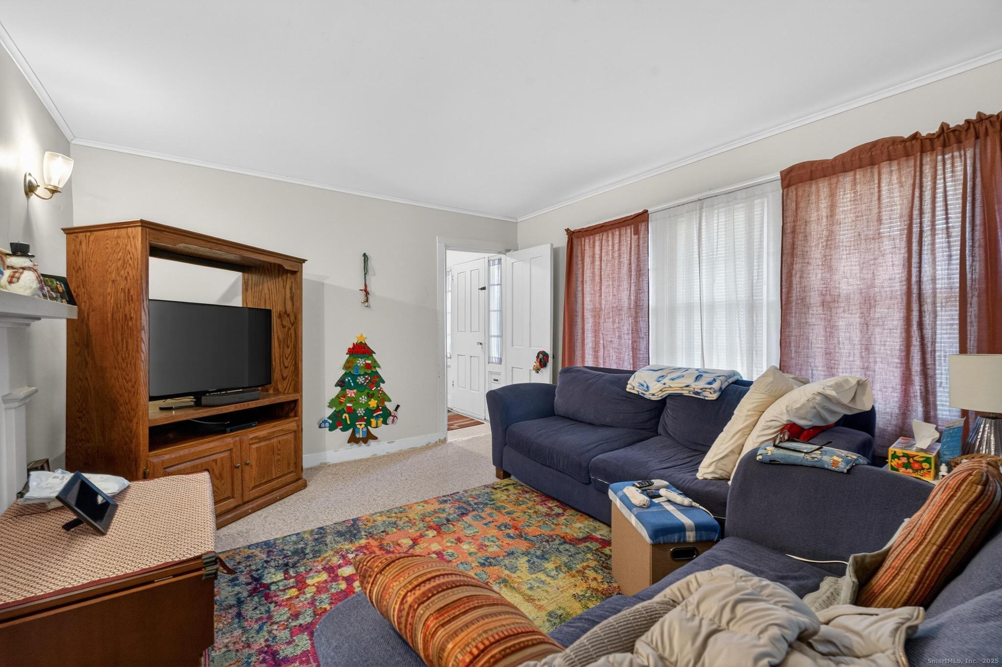 18 Broad Street Killingly, CT 06239 - Photo 9 of 21 a living room with furniture and a flat screen tv