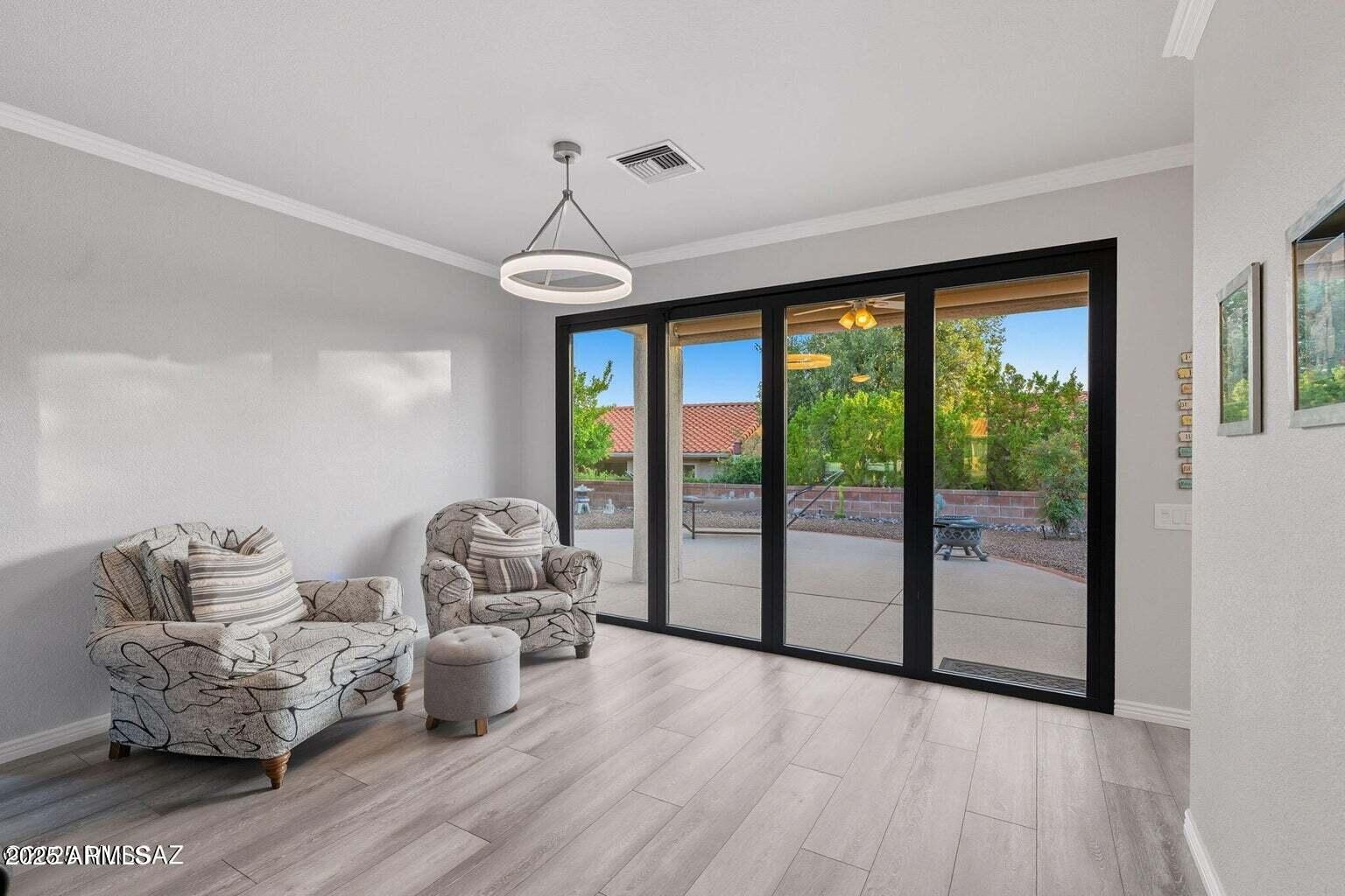 14705 North Palm Ridge Drive Oro Valley, AZ 85755 - Photo 11 of 49 a bedroom with furniture and large windows