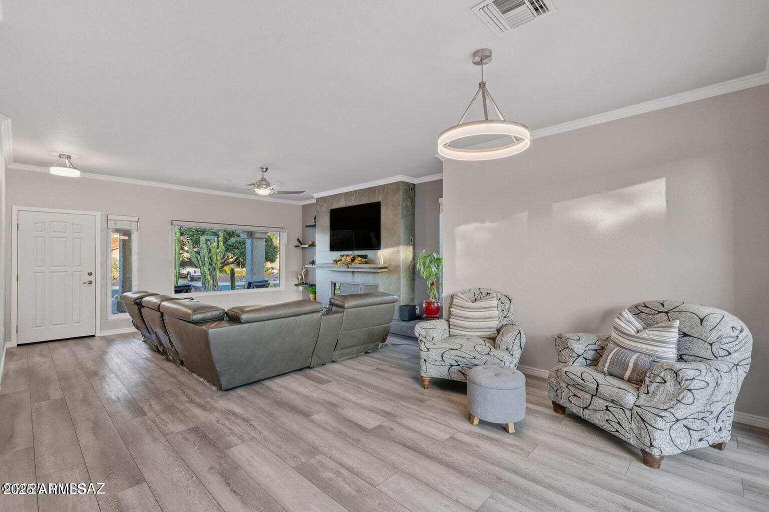 14705 North Palm Ridge Drive Oro Valley, AZ 85755 - Photo 12 of 49 a living room with furniture and a wooden floor