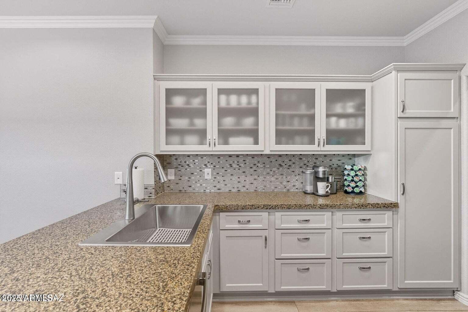 14705 North Palm Ridge Drive Oro Valley, AZ 85755 - Photo 17 of 49 a kitchen with granite countertop a sink and cabinets