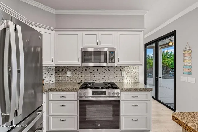 a kitchen with sink cabinets and window