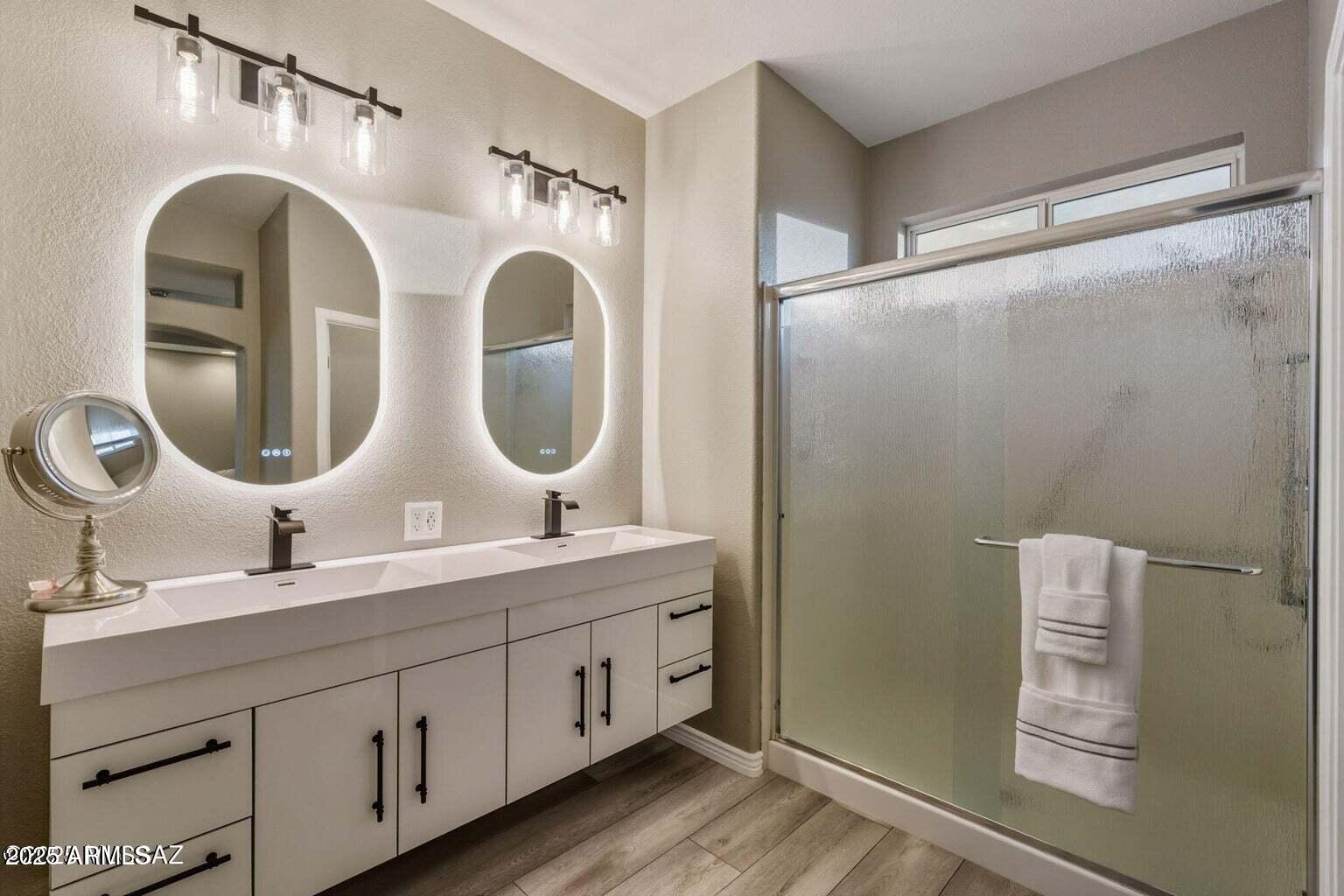 14705 North Palm Ridge Drive Oro Valley, AZ 85755 - Photo 26 of 49 a bathroom with a double vanity sink mirror and shower