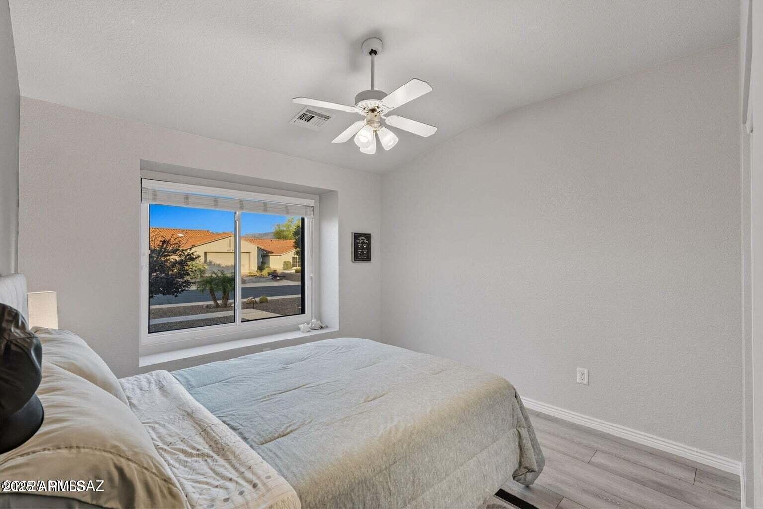 14705 North Palm Ridge Drive Oro Valley, AZ 85755 - Photo 28 of 49 a bedroom with a bed and a window