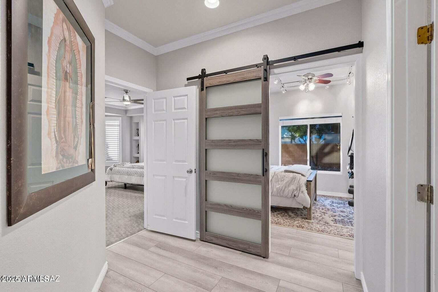 14705 North Palm Ridge Drive Oro Valley, AZ 85755 - Photo 31 of 49 a walk in closet with wooden floor and windows