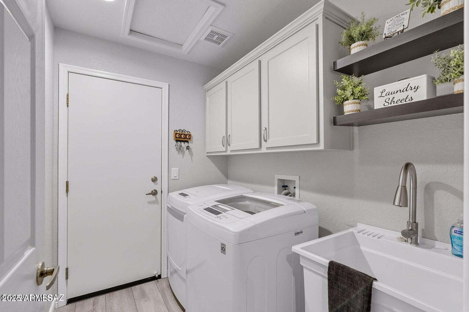 14705 North Palm Ridge Drive Oro Valley, AZ 85755 - Photo 33 of 49 a view of storage and utility room with two washing machine