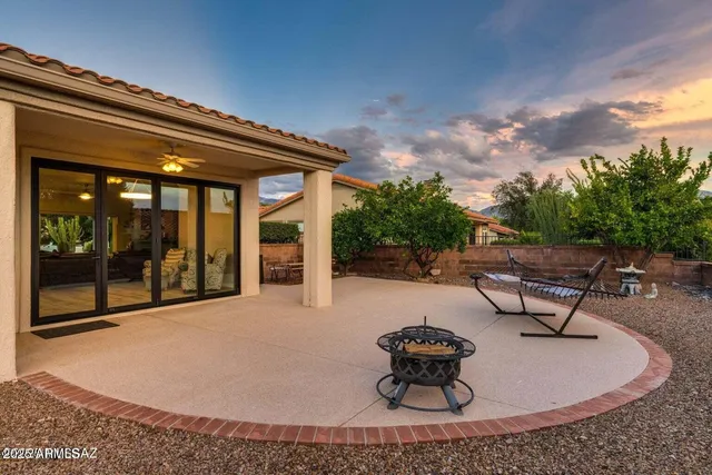 a view of a hallway with windows and chandelier