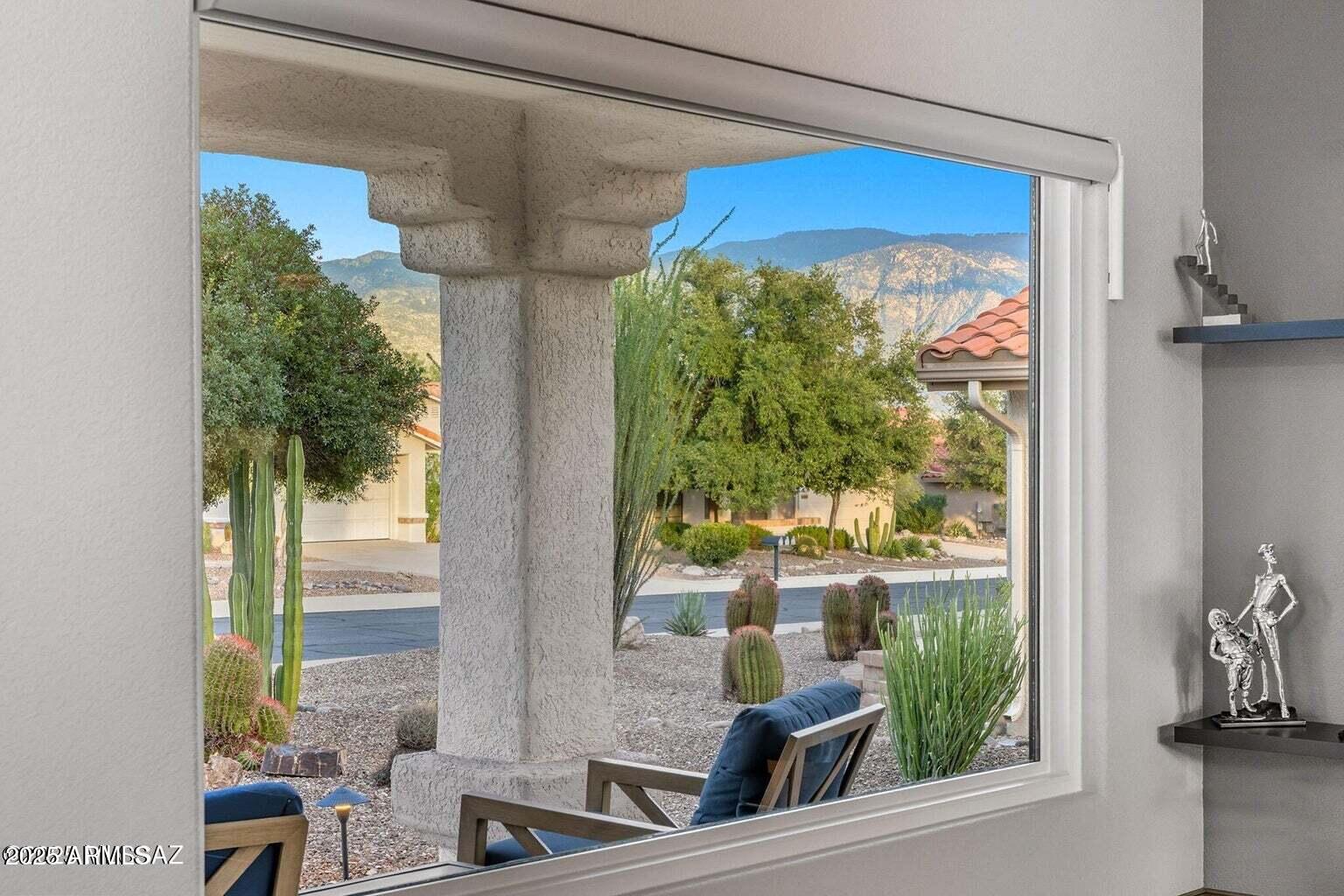 14705 North Palm Ridge Drive Oro Valley, AZ 85755 - Photo 8 of 49 a view of two chairs and a table in a balcony