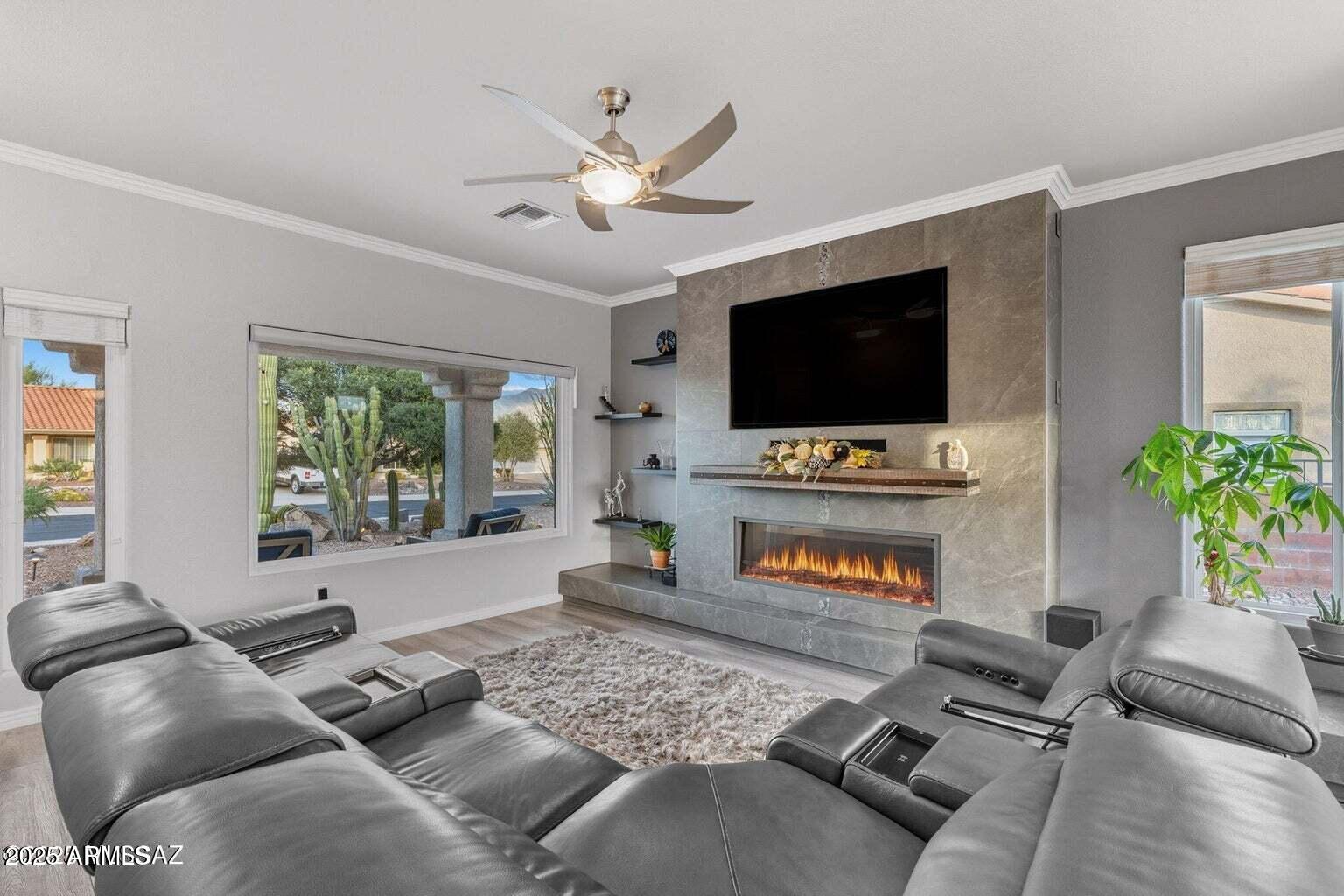 14705 North Palm Ridge Drive Oro Valley, AZ 85755 - Photo 9 of 49 a living room with furniture and a flat screen tv