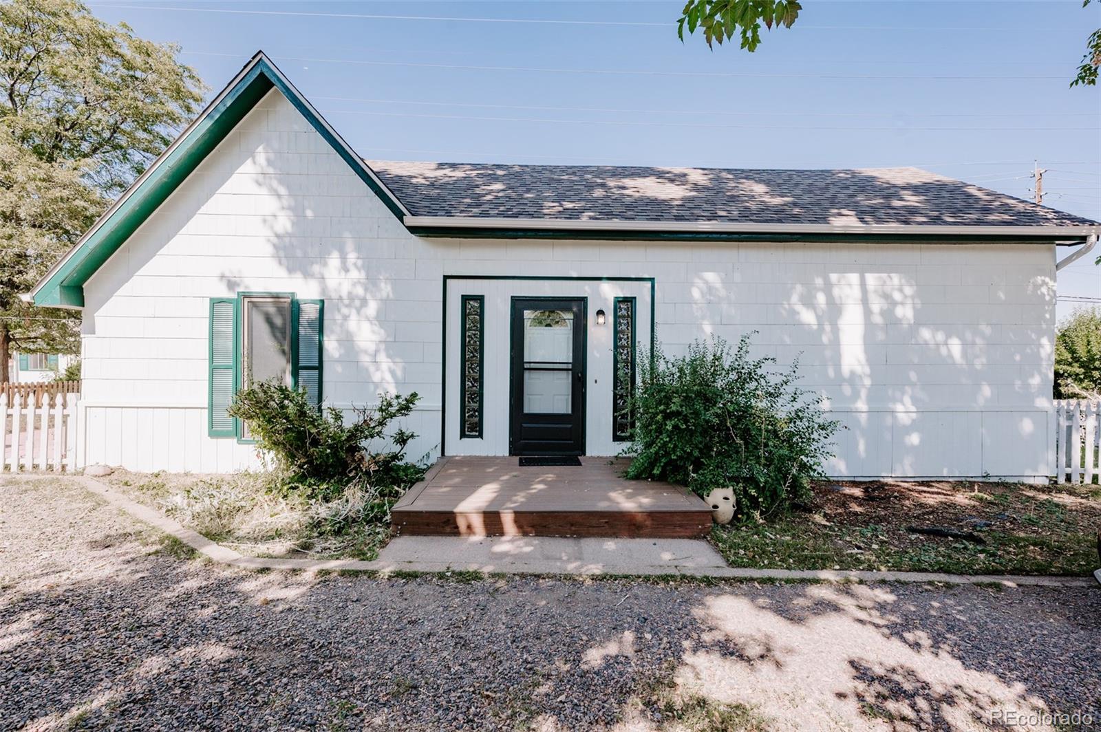 995 Moss Street Golden, CO 80401 - Photo 1 of 24 a front view of a house with garden