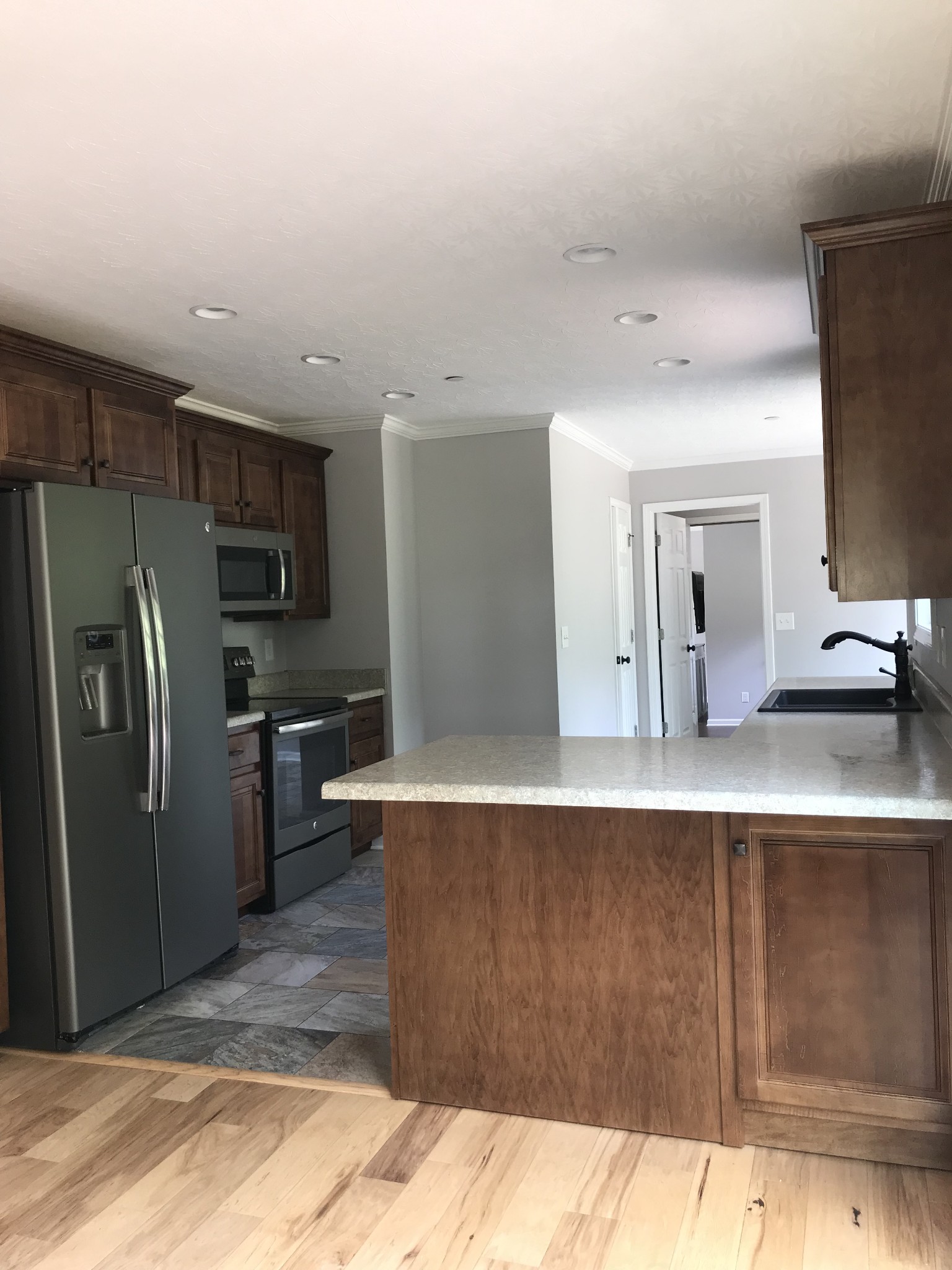 2029 Jack Teasley Road Pleasant View, TN 37146 - Photo 14 of 50 a kitchen with kitchen island a counter top space cabinets and stainless steel appliances
