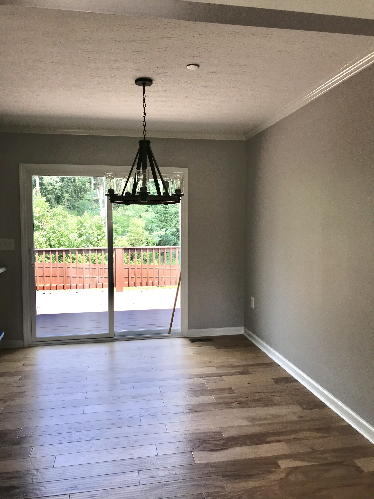 2029 Jack Teasley Road Pleasant View, TN 37146 - Photo 22 of 50 a view of an empty room with wooden floor and a window