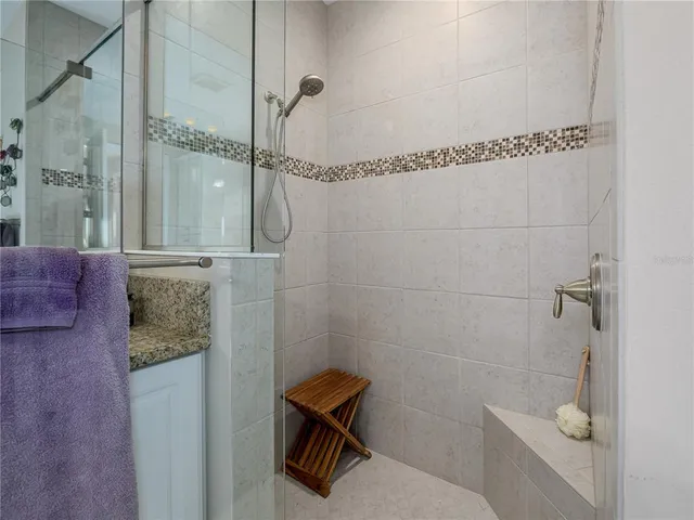 a bathroom with a shower and a toilet