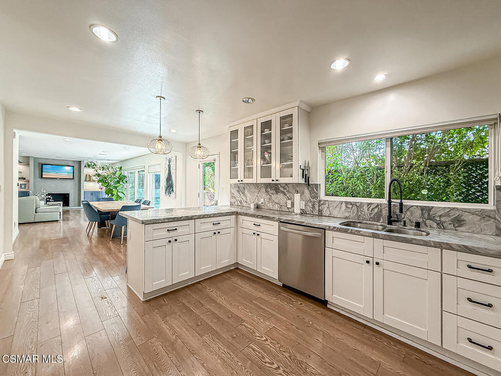 4184 Lanai Road Encino, CA 91436 - Photo 11 of 32 a kitchen with sink cabinets and wooden floor