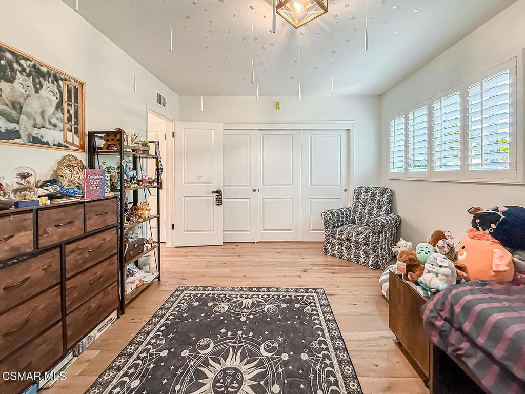 4184 Lanai Road Encino, CA 91436 - Photo 14 of 32 a living room with furniture and a window