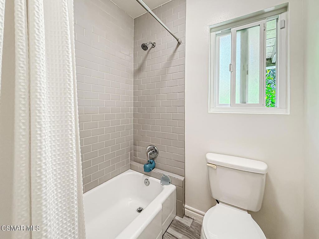 4184 Lanai Road Encino, CA 91436 - Photo 16 of 32 a white toilet sitting next to a bath tub