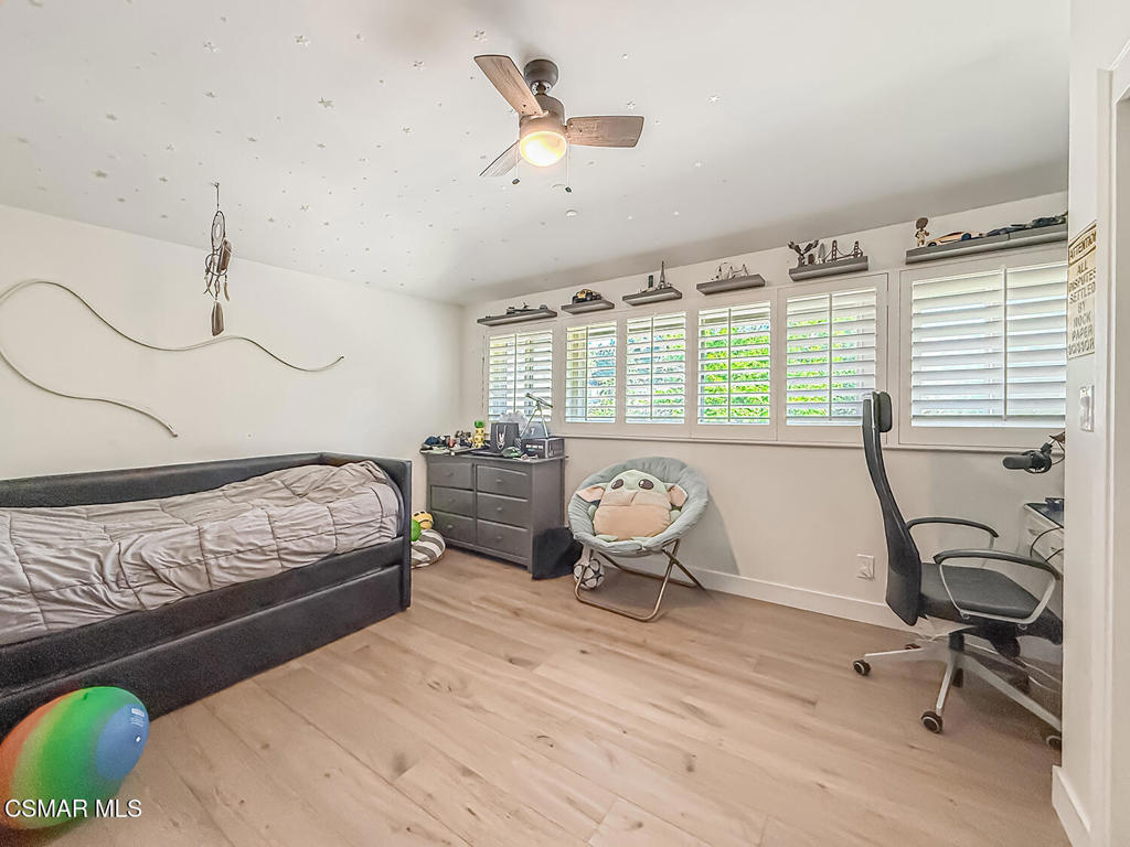 4184 Lanai Road Encino, CA 91436 - Photo 17 of 32 a bedroom with furniture and a window
