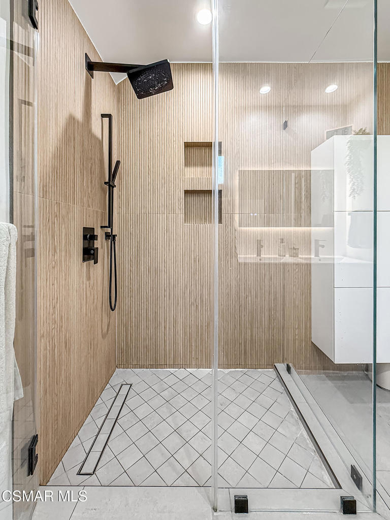 4184 Lanai Road Encino, CA 91436 - Photo 22 of 32 a bedroom with a bed and a shower