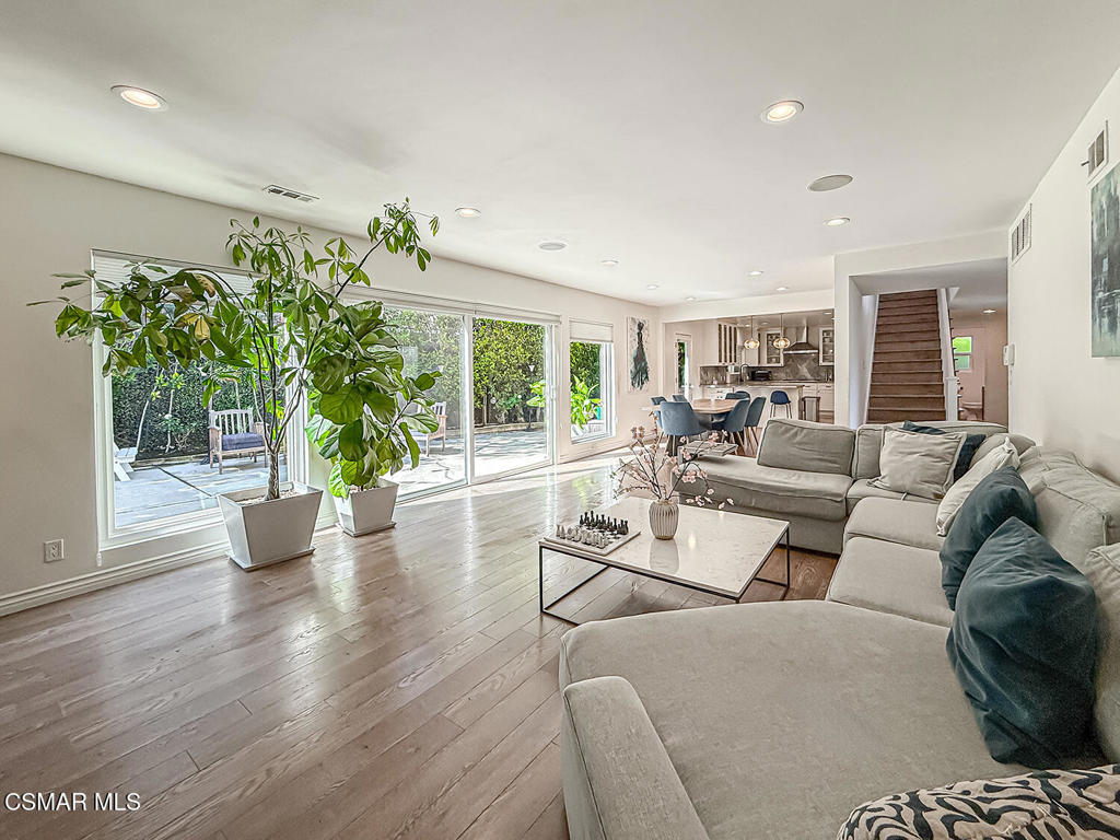 4184 Lanai Road Encino, CA 91436 - Photo 5 of 32 a living room with furniture and a potted plant